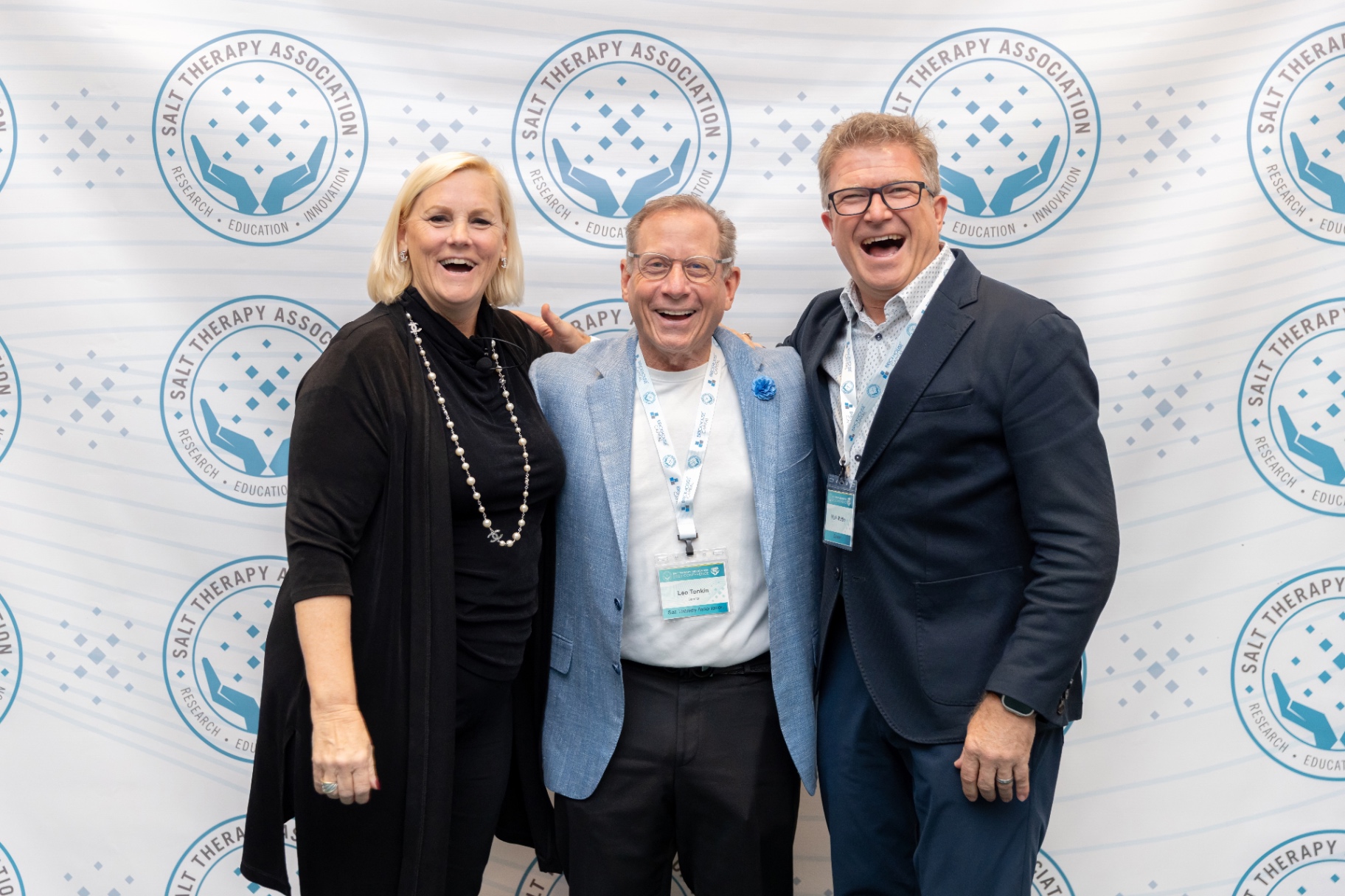 Industry leaders laughing together at STACon.