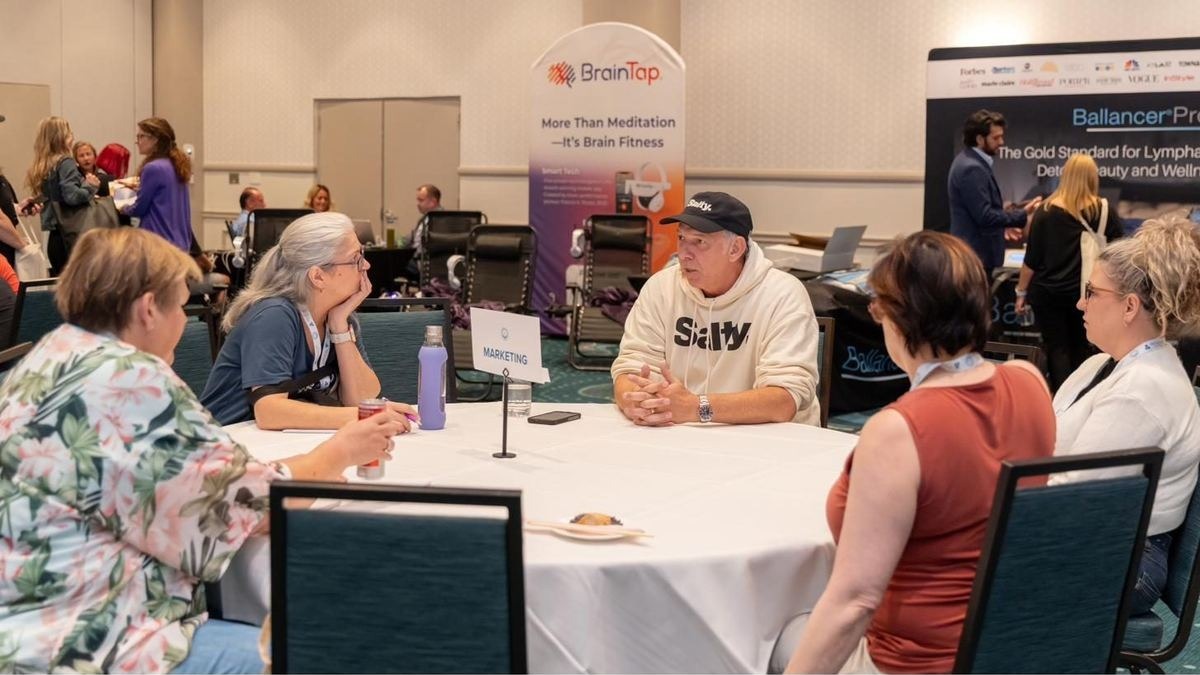 Members in conversation around a roundtable at STACon.