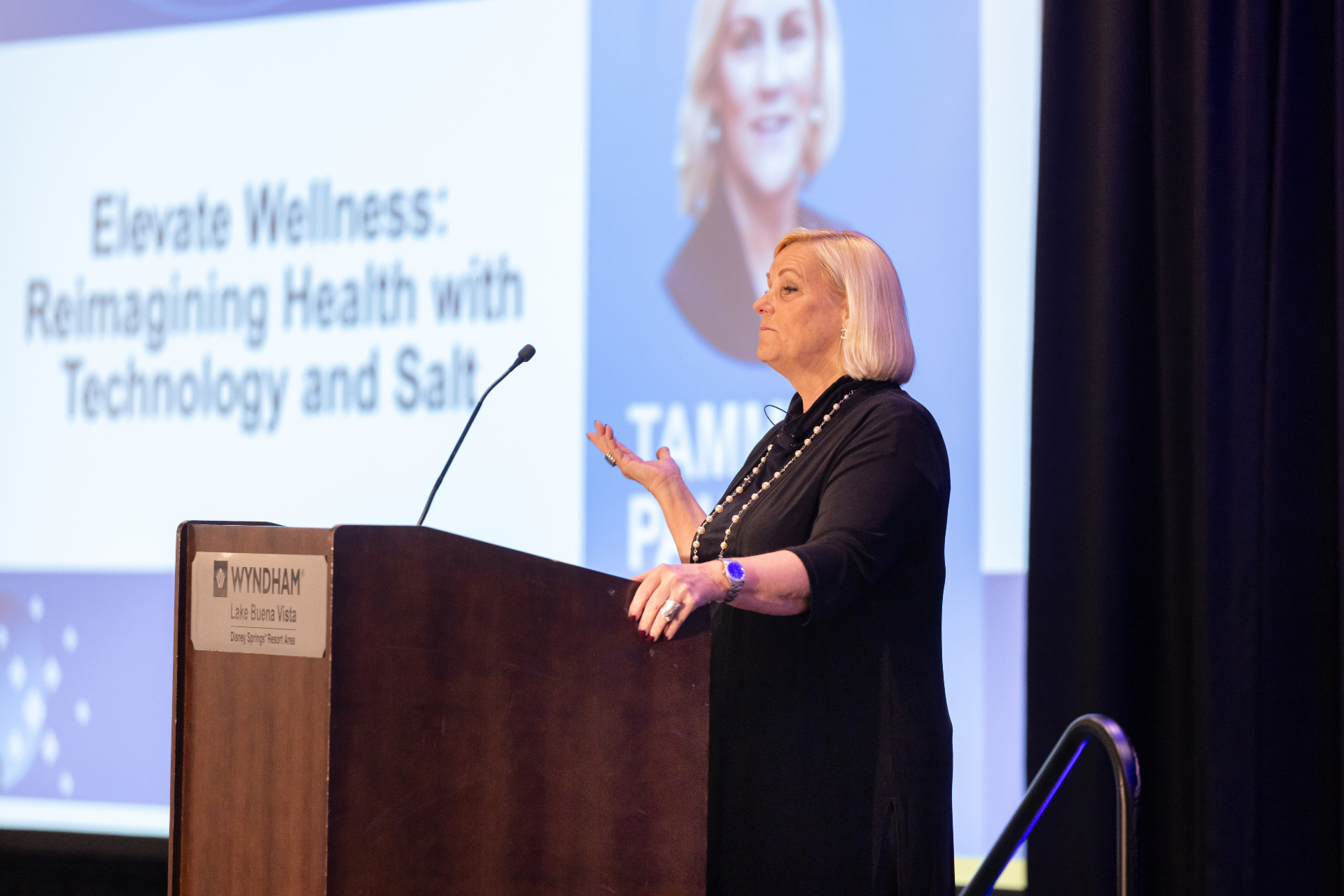 Keynote speaker presenting Elevate Wellness on the STACon mainstage.