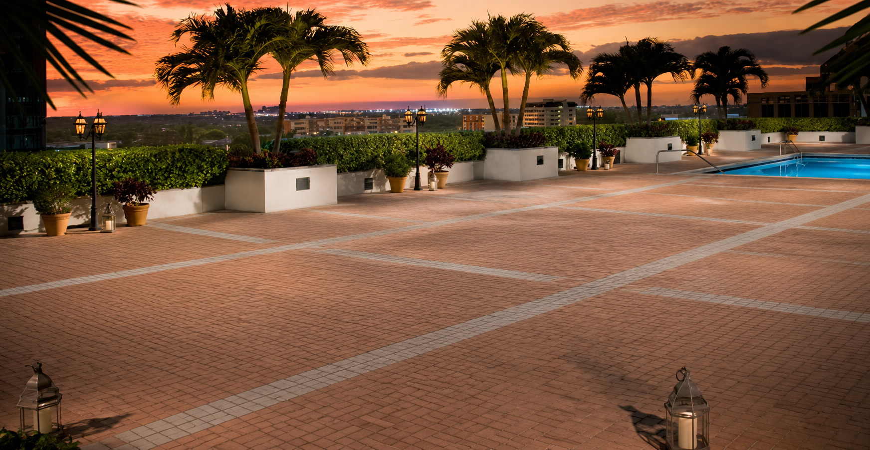 Rooftop pool deck at sunset.