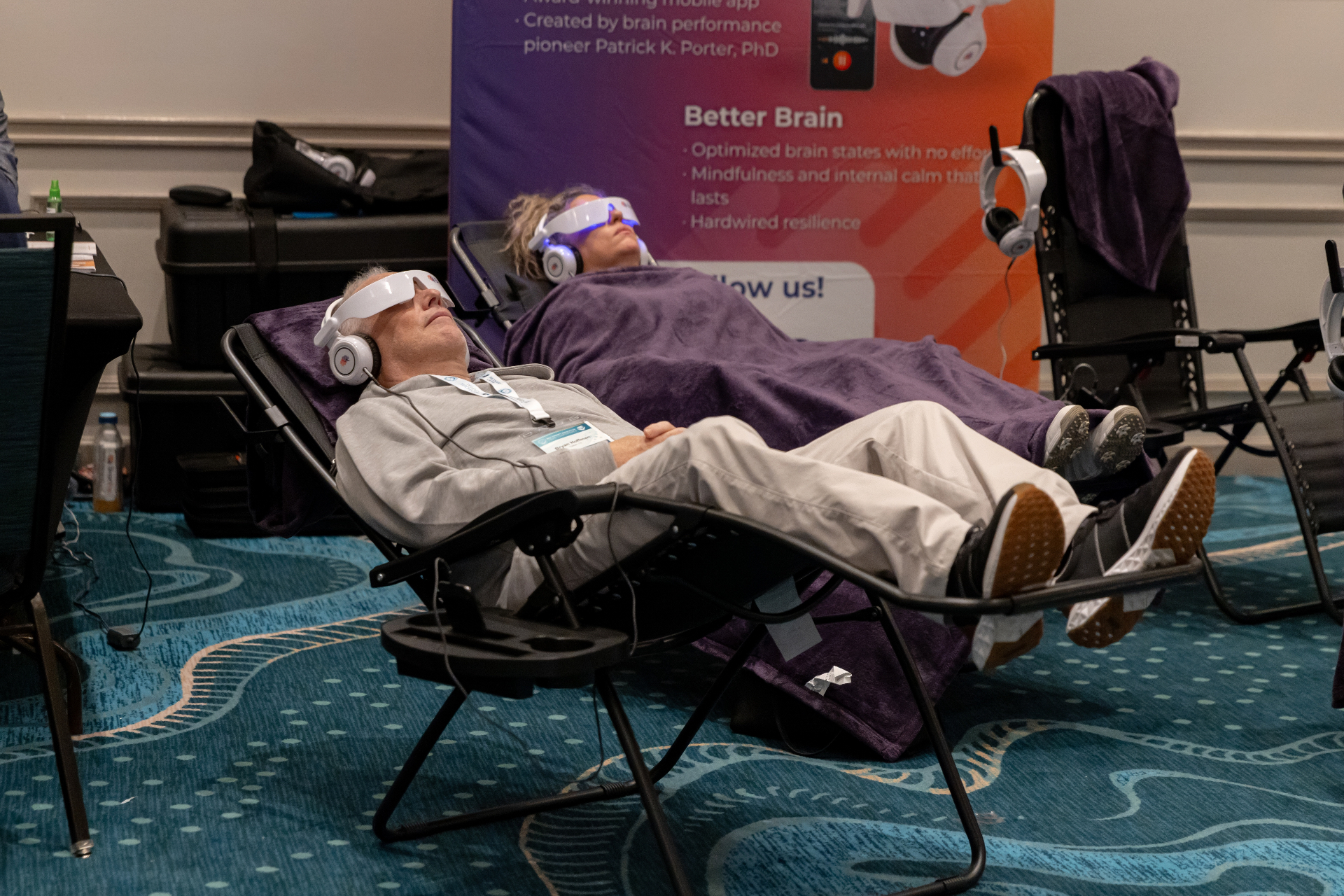 Attendee trying brainwave relaxation device.