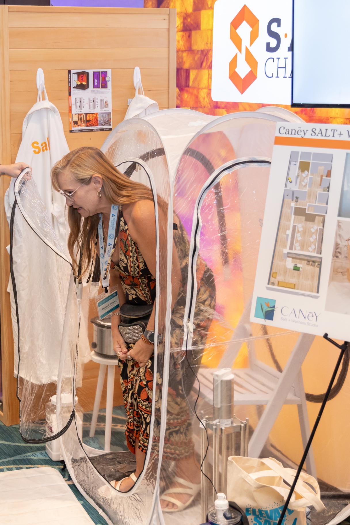 Attendee stepping into a portable Caney salt pod.