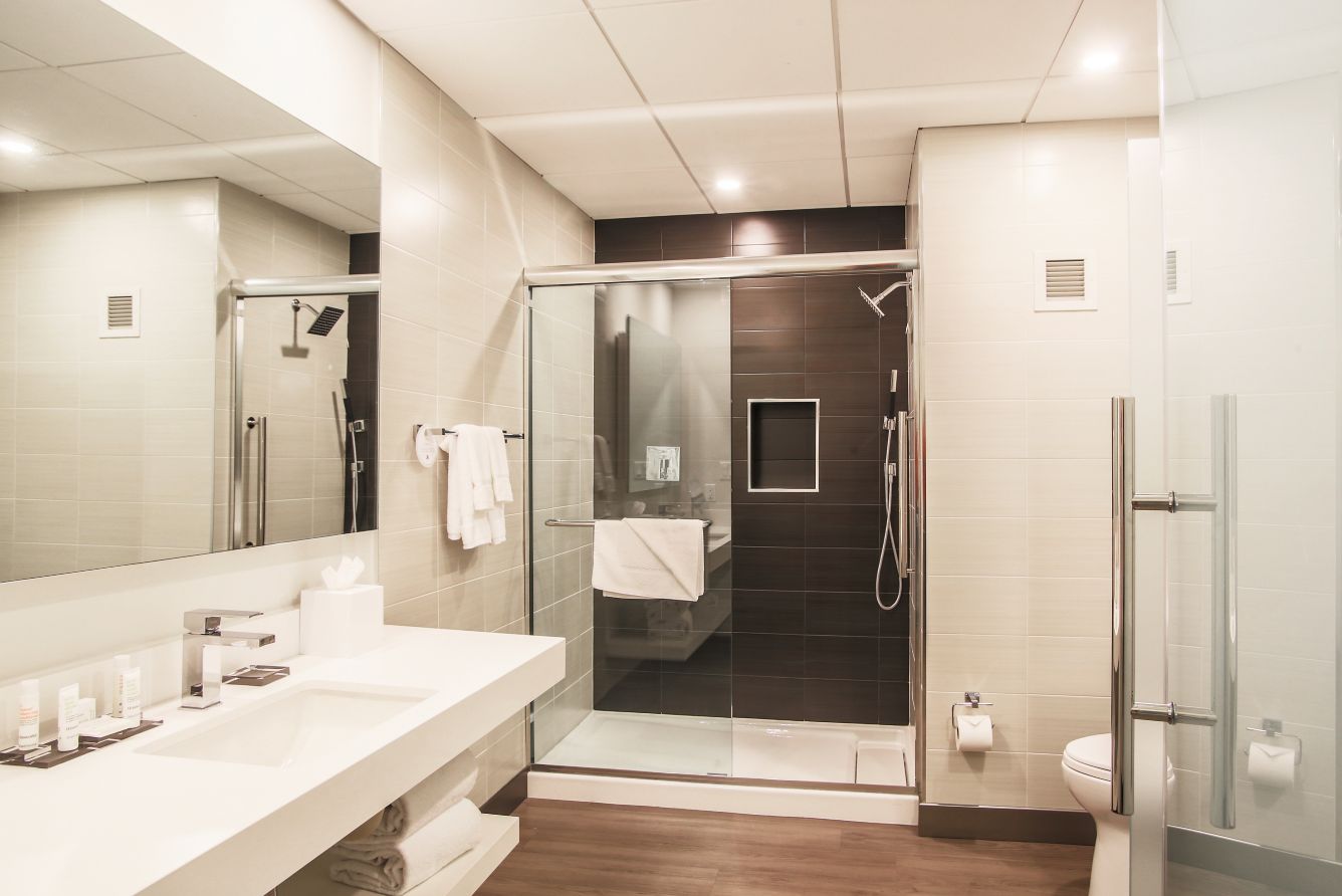 Renovated guest bathroom with walk-in shower.