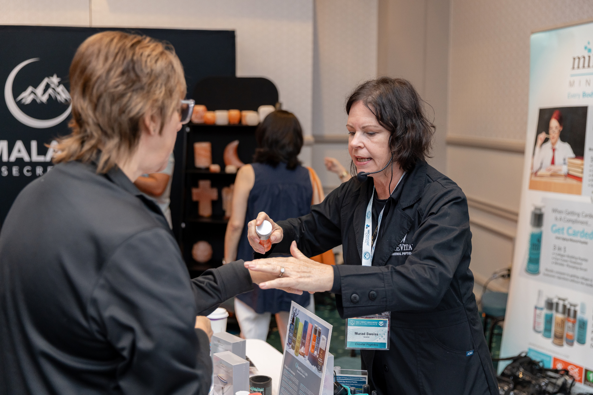 STACon vendor booth conversation.